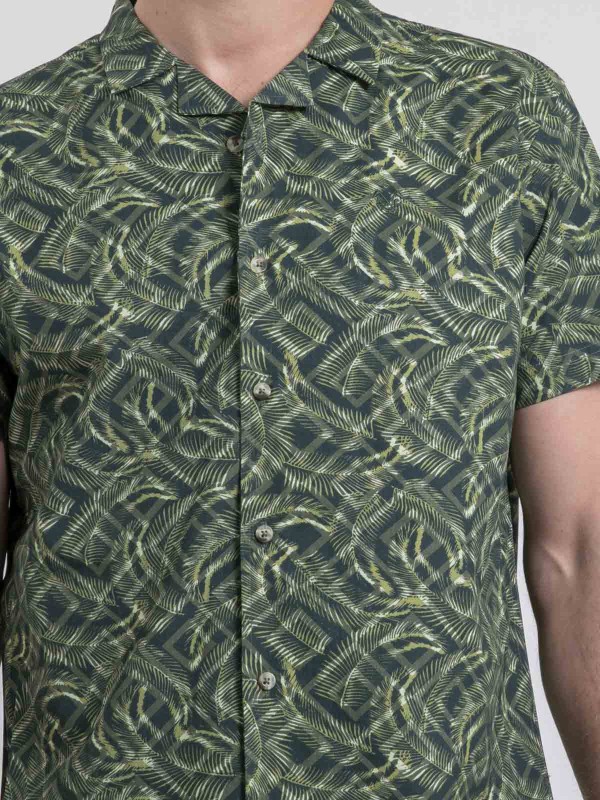 Chemise manches courtes...