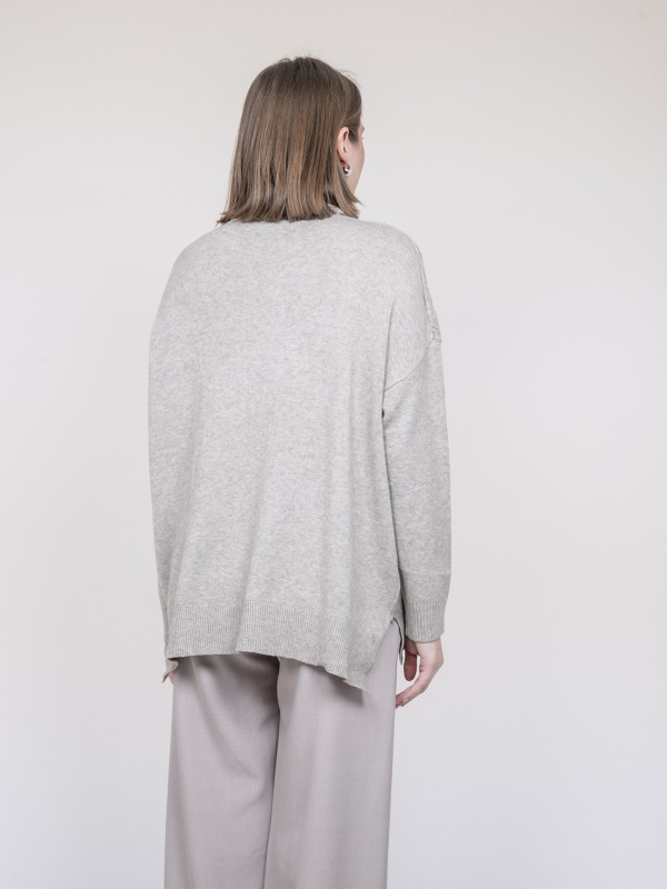 Pull col roulé à sequins...