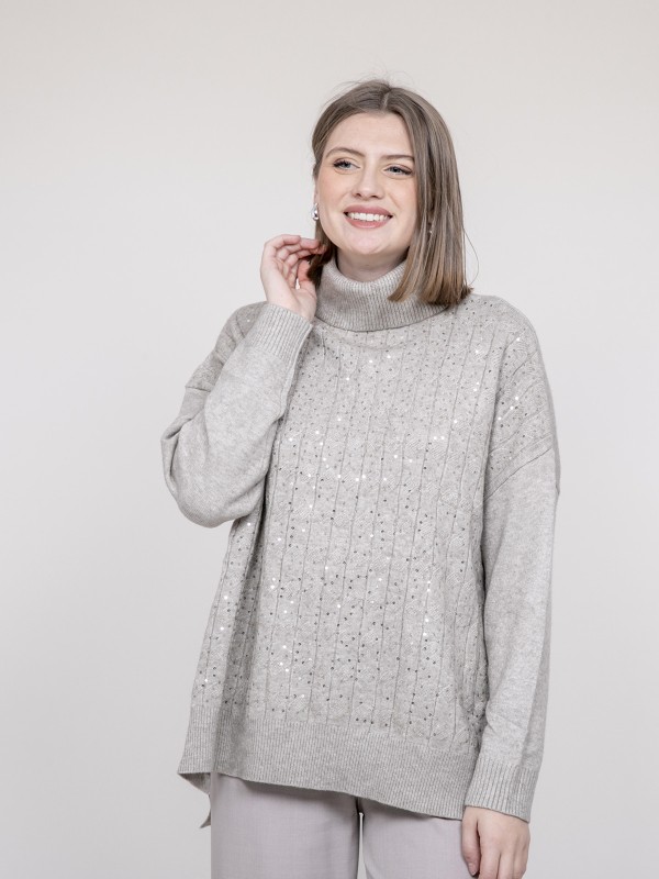 Pull col roulé à sequins...