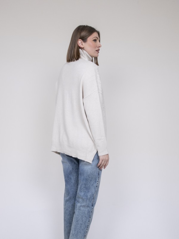 Pull col roulé à sequins...