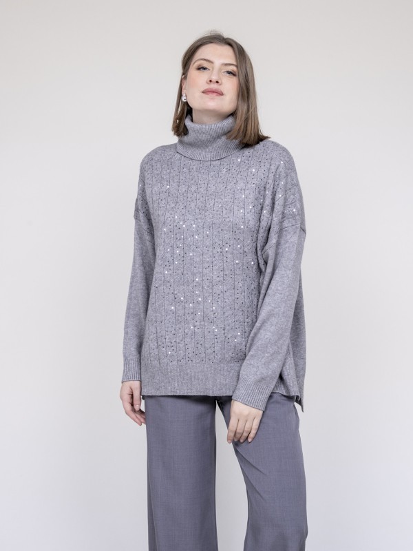 Pull col roulé à sequins...