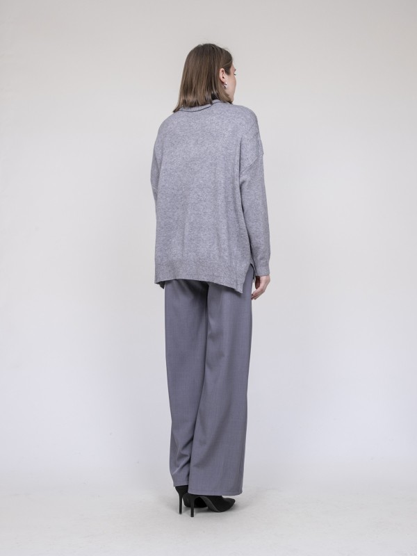 Pull col roulé à sequins...