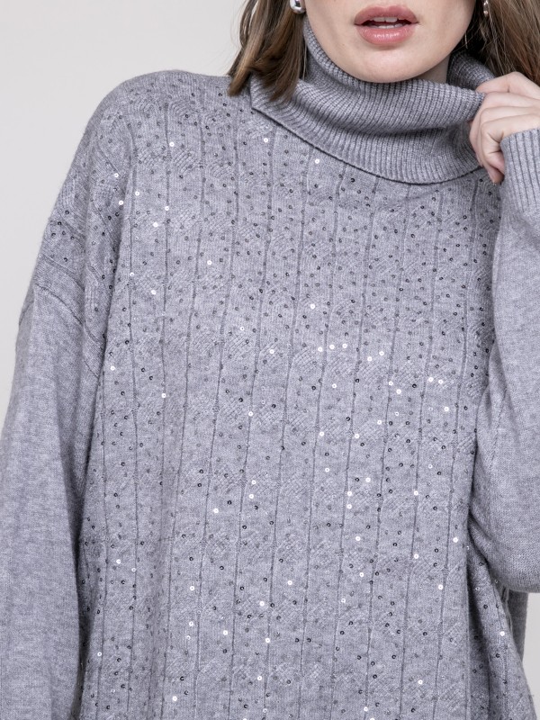 Pull col roulé à sequins...