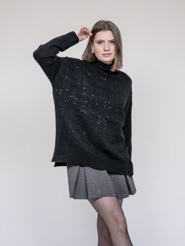 Pull col roulé à sequins...