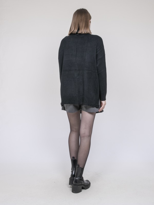 Pull col roulé à sequins...