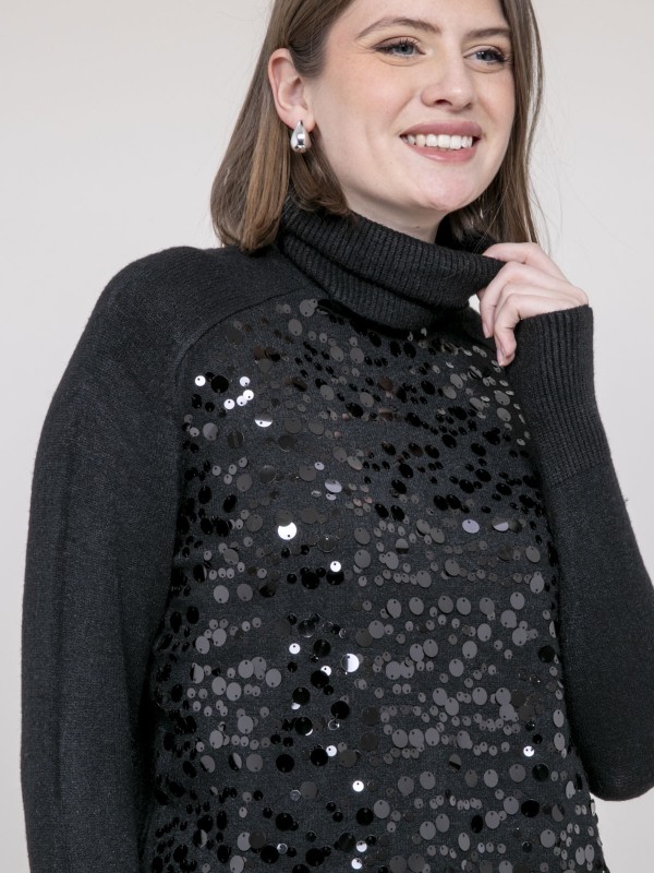 Pull col roulé à sequins...