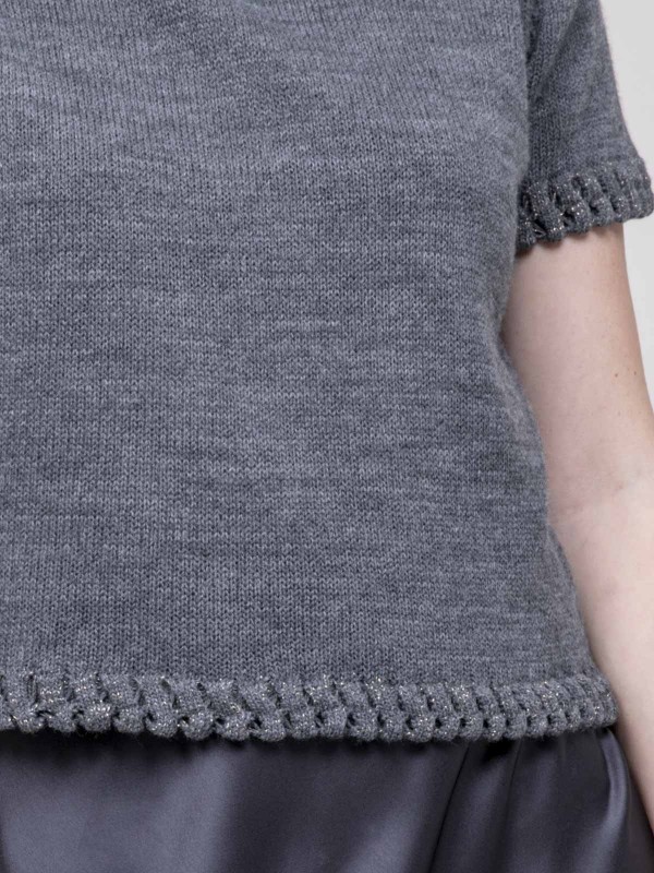 Pull details tressés...